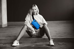 Sustainable Crossbody Bag in vibrant blue. Made from 100% GRS certified recycled polyester. Can be worn across the front of your body.